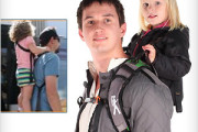Piggyback carrier where child stands on foot-bar