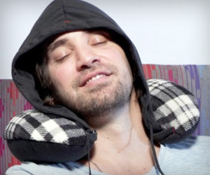travel pillow with attached hoodie to cover head